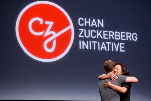 Priscilla Chan embraces her husband Mark Zuckerberg while announcing the Chan Zuckerberg Initiative to 